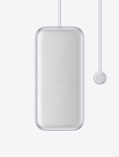 Batterie d’Apple Vision Pro, face externe, logo Apple centré, câble d’alimentation intégré avec connecteur rond à une extrémité, voyant à DEL sur le connecteur
