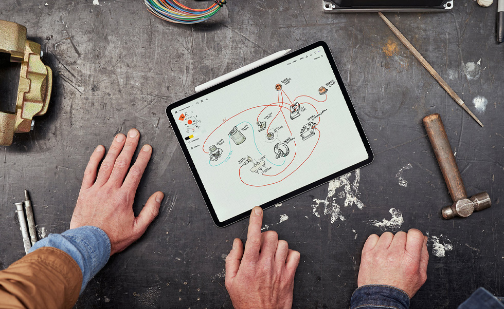 The team uses iPhone, iPad, and Apple Pencil to scan vehicles, create mood boards, and design 3D models.