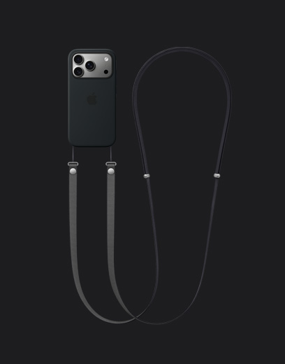 Ezüstszínű iPhone 17 Pro hátulnézetből, rajta fekete MagSafe-rögzítésű szilikontok sötétszürke Crossbody pánttal